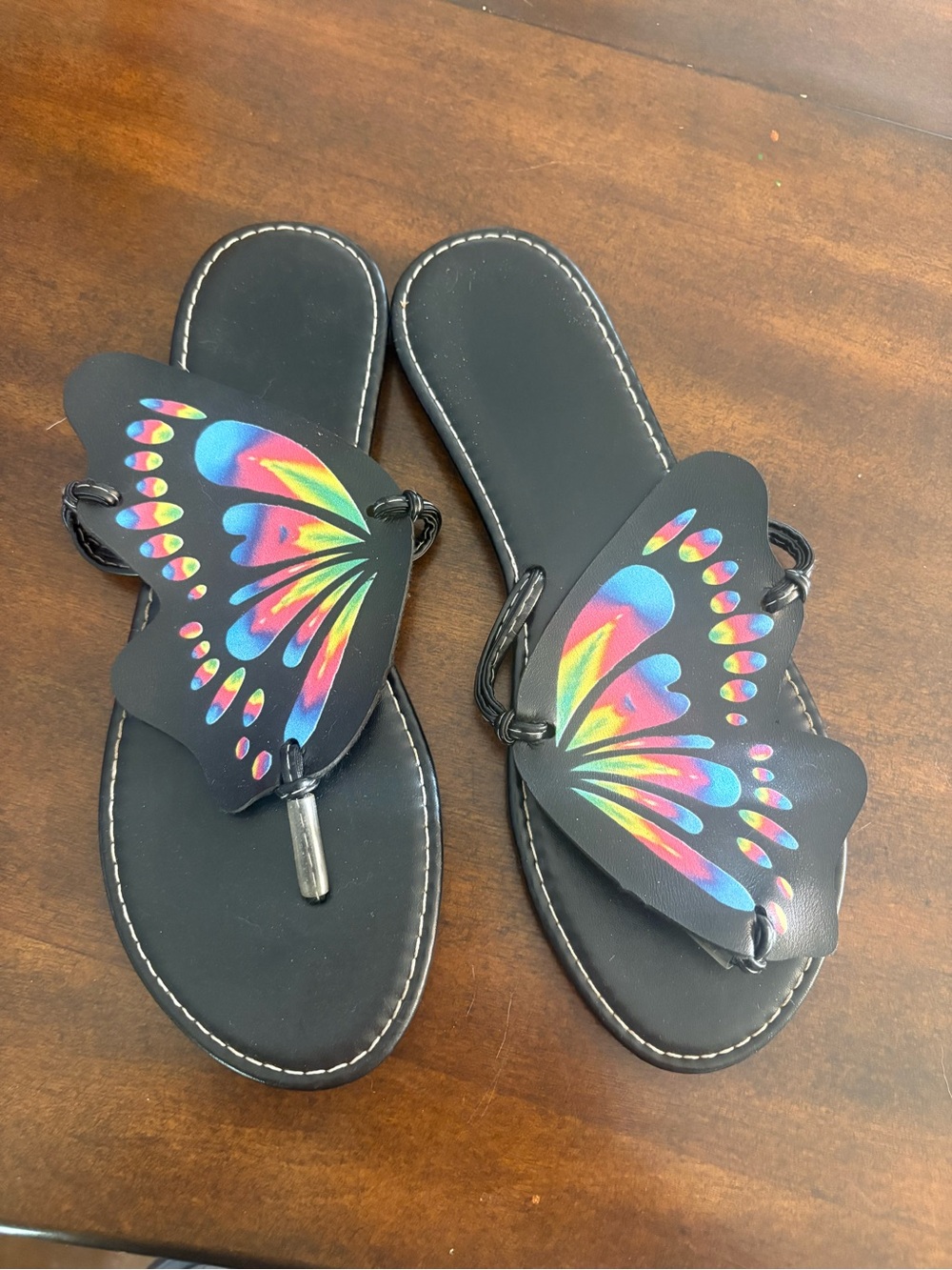 SHEIN women Black Flip Flops with Rainbow Butterfly Accent